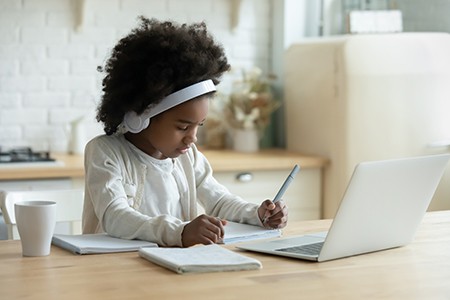 girl on laptop at home