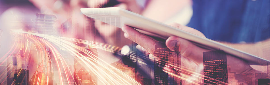 mobile tablet in hand with city skyline