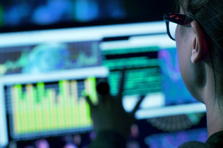 woman doing research on computer